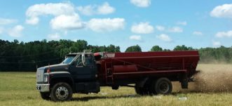 solid manure spreader truck making calibration run