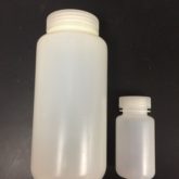 Picture holds two HDPE bottles one ~500 mL in size and one that is ~50 mL in size.