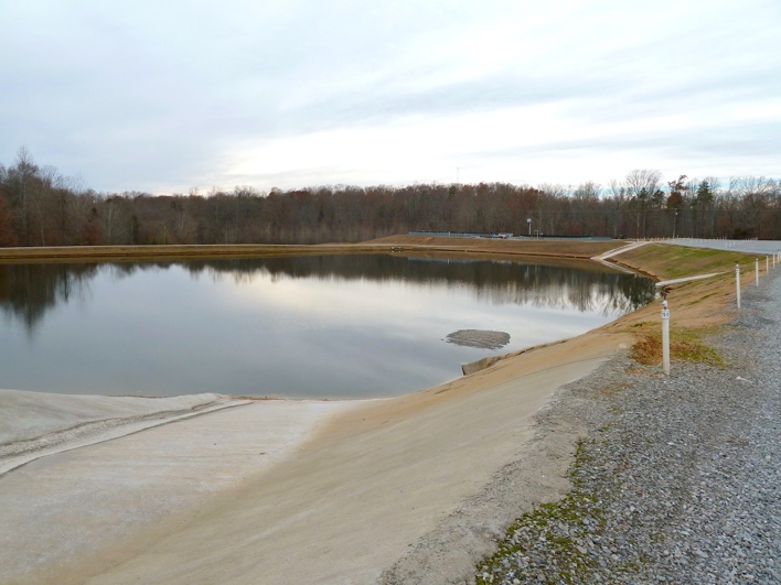 Irrigation pond with concrete lined spillways where runoff water enters the ponds